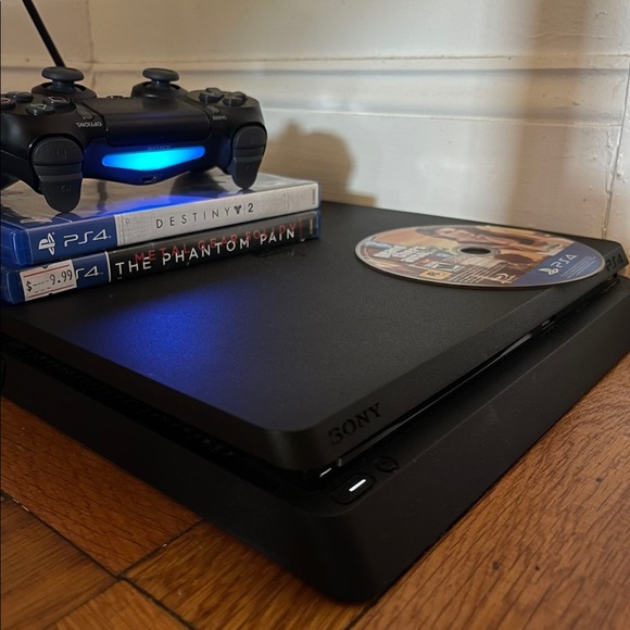 PS4 Slim 1TB With 6 Games And one Controller. Black color. Been used before. - Picture 2 of 4